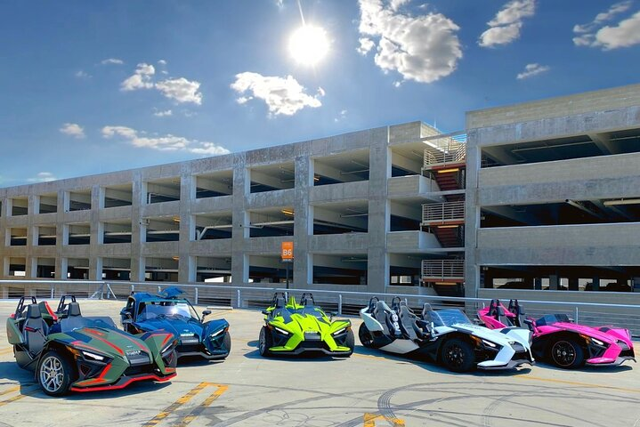 Experience the freedom of cruising through Los Angeles with the largest fleet of Polaris SlingShots showcasing a stunning array of colors and designs waiting for your adventure.